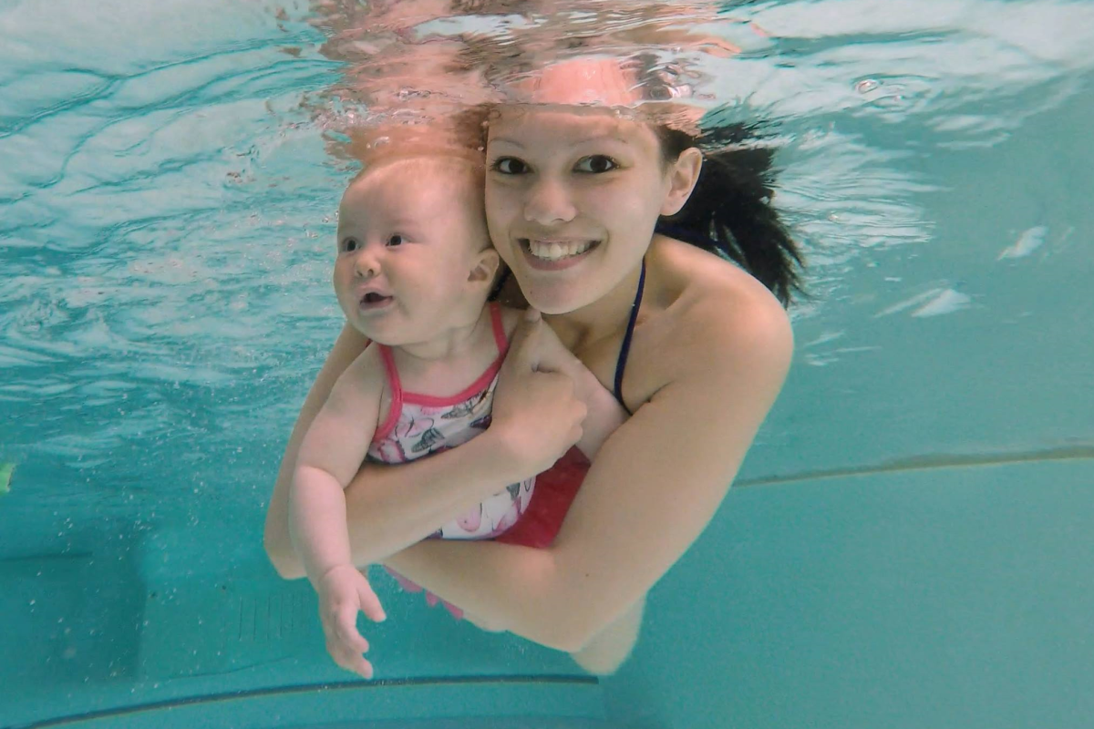 Mother and baby swim