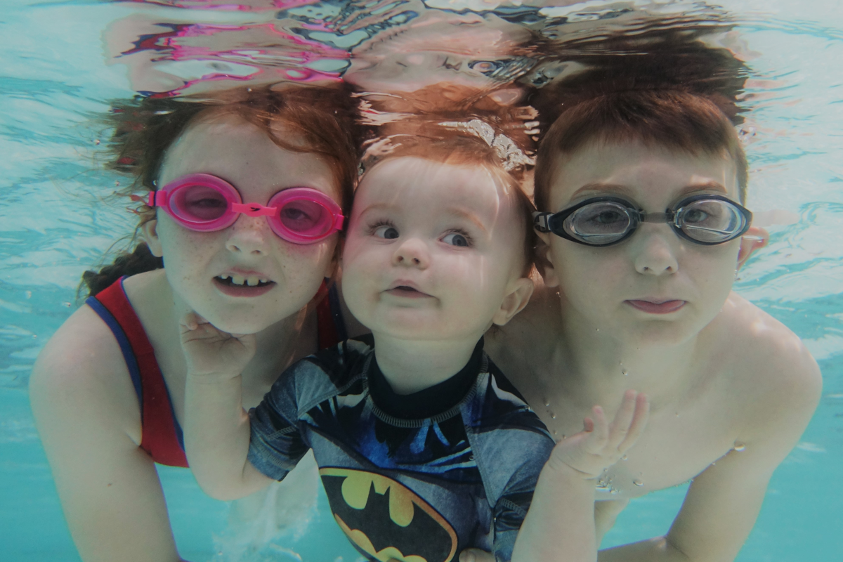 Family swimming underwater